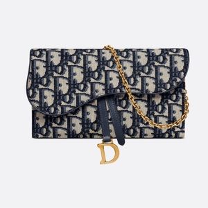 Dior saddle wallet on a chain.